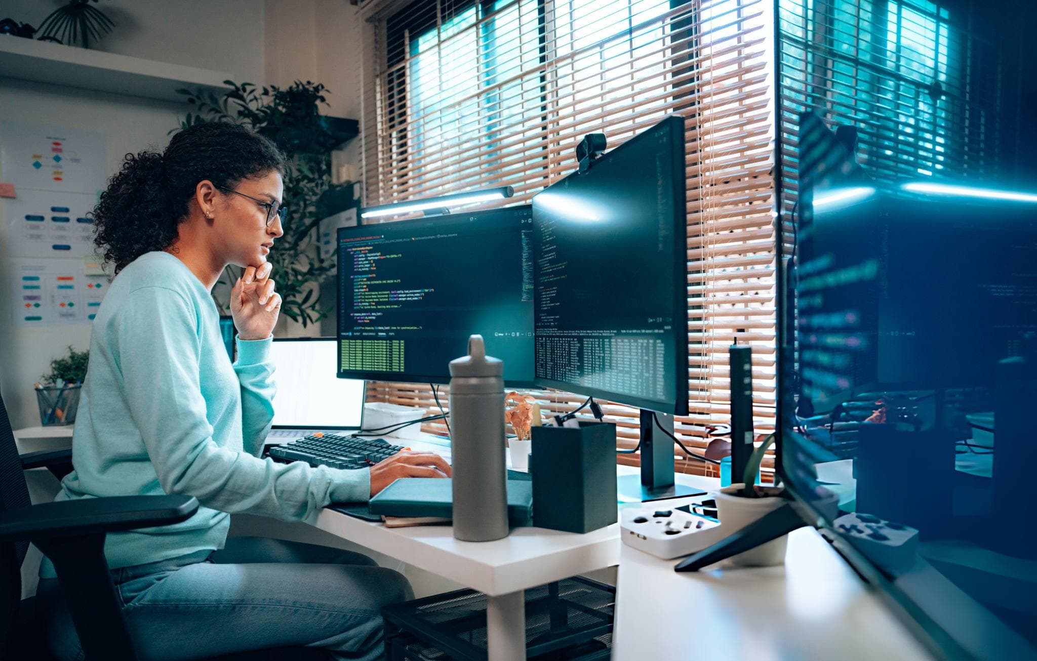A developer building a web application at a workstation
